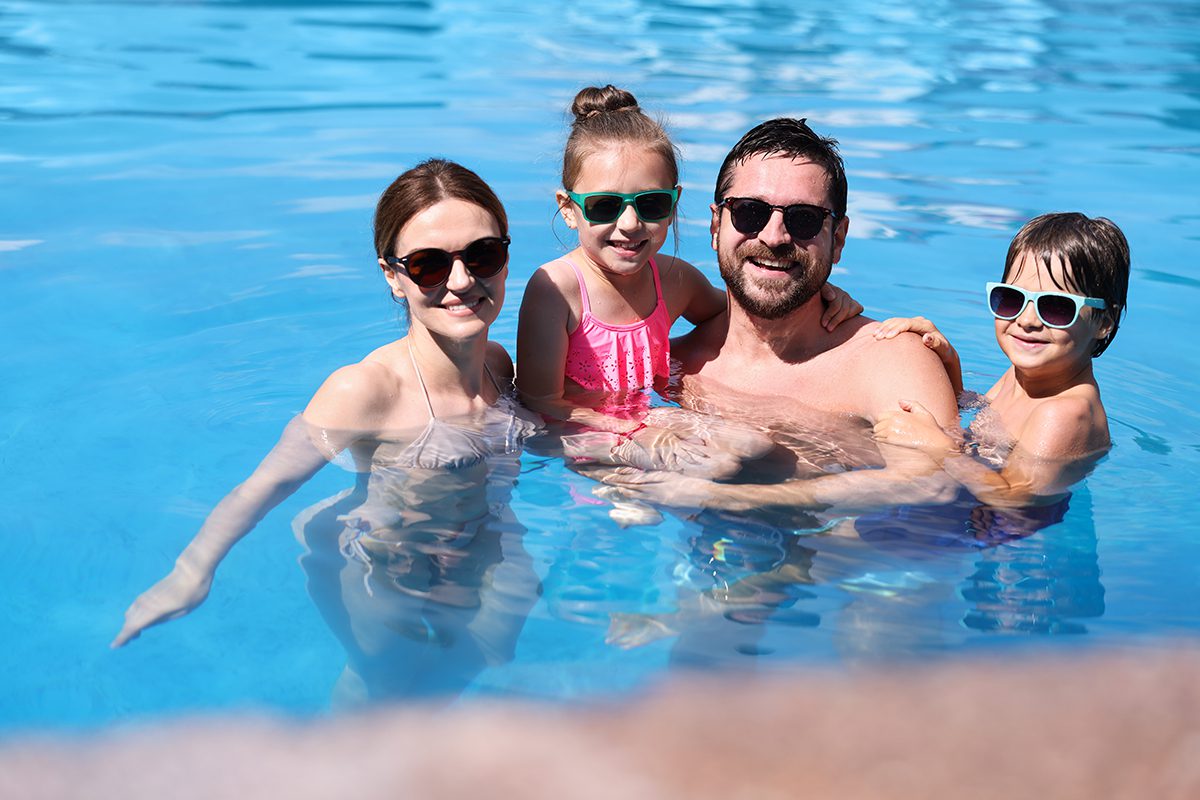 photo of the family enjoying the outdoor pool