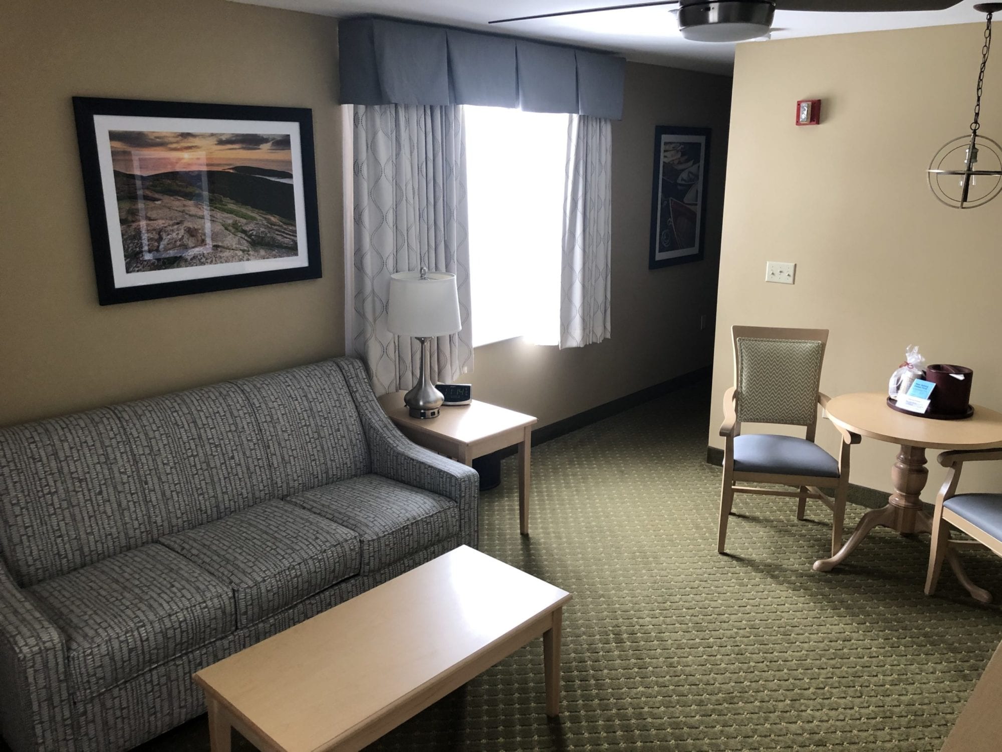 Photo of the living room of the Accessible King Suite at the Acadia Inn.